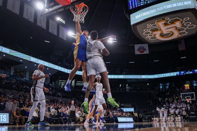 Jan 14, 2026; Atlanta, Georgia, USA; Pittsburgh Panthers forward Roman Siulepa (13) attempts a dunk over Georgia Tech Yellow Jackets center Peyton Marshall (5) in the first half at McCamish Pavilion. Mandatory Credit: Brett Davis-Imagn Images