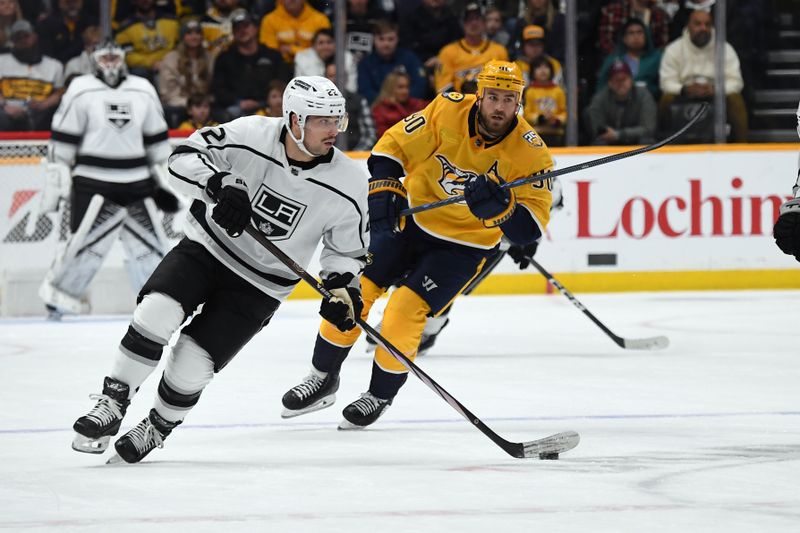 Jan 31, 2024; Nashville, Tennessee, USA; Los Angeles Kings left wing Kevin Fiala (22) skates the puck into the offensive zone during the second period against the Nashville Predators at Bridgestone Arena. Mandatory Credit: Christopher Hanewinckel-USA TODAY Sports