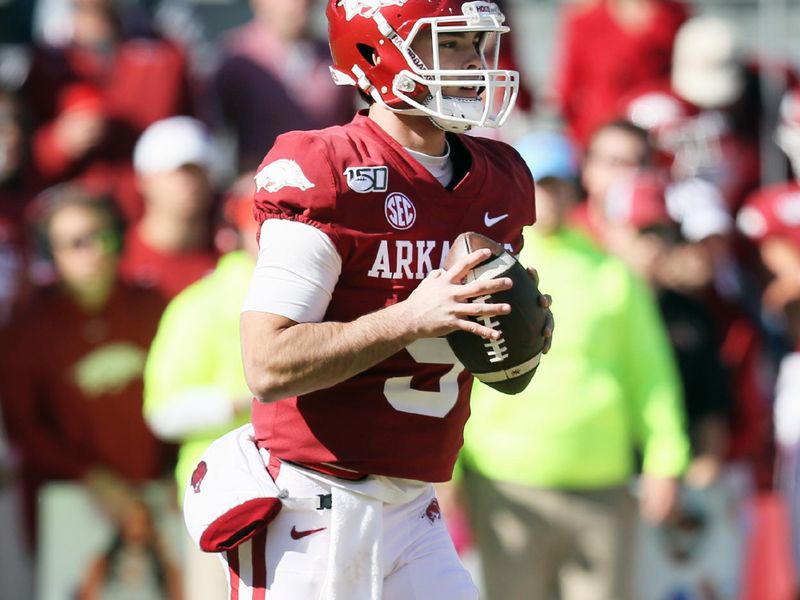 Nov 9, 2019; Fayetteville, AR, USA; Arkansas Razorbacks quarterback John Stephen Jones (9) drops back to pass in the first quarter against the Western Kentucky Hilltoppers at Donald W. Reynolds Razorback Stadium. Mandatory Credit: Nelson Chenault-USA TODAY Sports