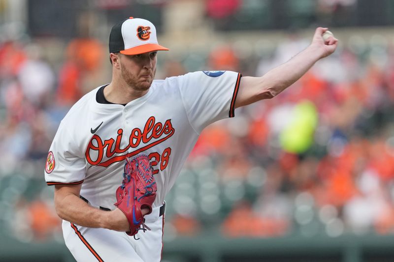 Aug 13, 2024; Baltimore, Maryland, USA; Baltimore Orioles pitcher Trevor Rogers (28) pitches in the first inning against the Washington Nationals at Oriole Park at Camden Yards. Mandatory Credit: Mitch Stringer-USA TODAY Sports