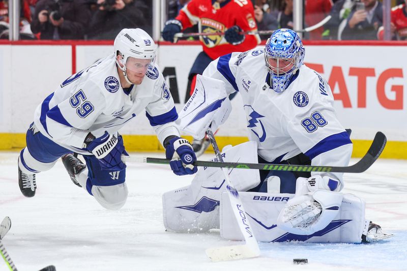 Apr 26, 2025; Sunrise, Florida, USA; Tampa Bay Lightning goaltender Andrei Vasilevskiy (88) make a save against the Florida Panthers in the third period during game three of the first round of the 2025 Stanley Cup Playoffs at Amerant Bank Arena. Mandatory Credit: Nathan Ray Seebeck-Imagn Images