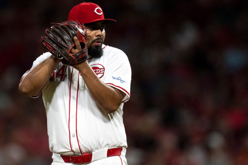 Aug 3, 2024; Cincinnati, Ohio, USA; Cincinnati Reds pitcher Tony Santillan (64) comes set against the San Francisco Giants in the eighth inning at Great American Ball Park. Mandatory Credit: Albert Cesare-USA TODAY Sports