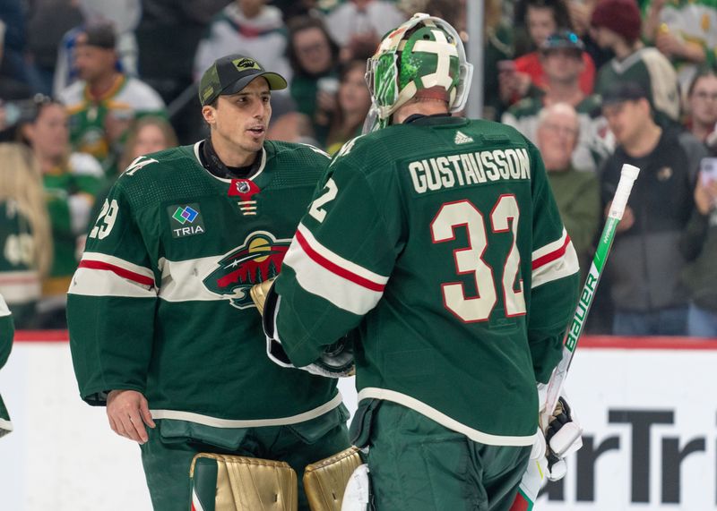 Apr 8, 2023; Saint Paul, Minnesota, USA; Minnesota Wild goaltender Marc-Andre Fleury (29) congratulates goaltender Filip Gustavsson (32) on a win after the game against the St. Louis Blues at Xcel Energy Center. Mandatory Credit: Matt Blewett-USA TODAY Sports