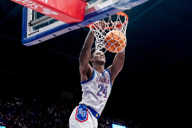 Dec 5, 2023; Lawrence, Kansas, USA; Kansas Jayhawks forward K.J. Adams Jr. (24) dunks the ball against the UMKC Kangaroos during the second half at Allen Fieldhouse. Mandatory Credit: Denny Medley-USA TODAY Sports