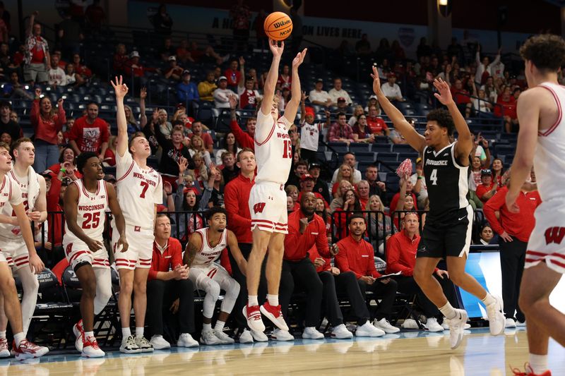 Nov 27, 2025; San Diego, CA, USA; Wisconsin Badgers guard Isaac Gard (15) shoots the ball against Providence Friars during the second half at Jenny Craig Pavilion. Mandatory Credit: Abe Arredondo-Imagn Images