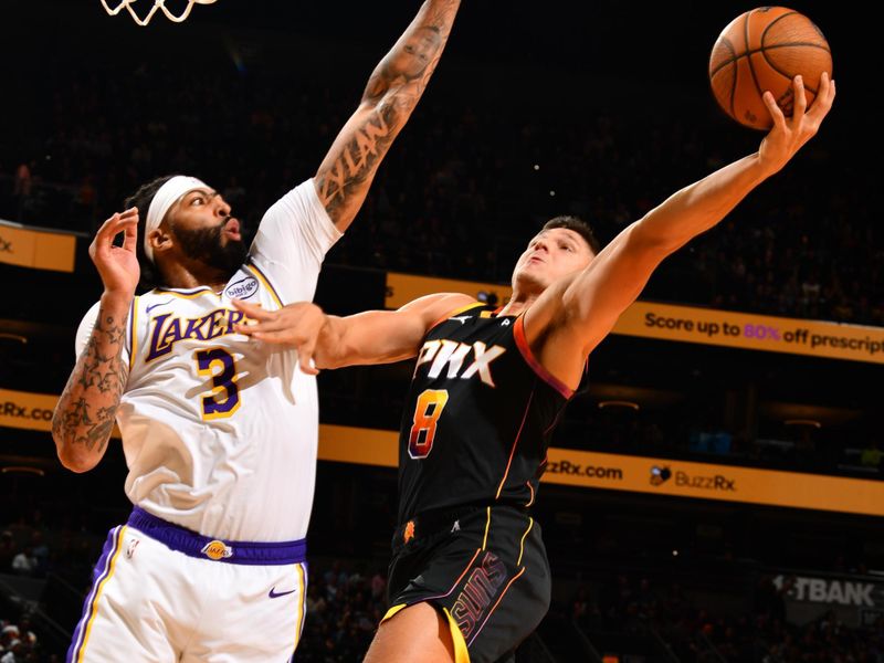 PHOENIX, AZ - NOVEMBER 26: Grayson Allen #8 of the Phoenix Suns drives to the basket during the game against the Los Angeles Lakers during the Emirates NBA Cup game on November 26, 2024 at Footprint Center in Phoenix, Arizona. NOTE TO USER: User expressly acknowledges and agrees that, by downloading and or using this photograph, user is consenting to the terms and conditions of the Getty Images License Agreement. Mandatory Copyright Notice: Copyright 2024 NBAE (Photo by Barry Gossage/NBAE via Getty Images)