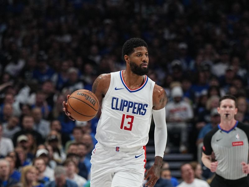 DALLAS, TX - APRIL 28: Paul George #13 of the LA Clippers handles the ball during the game against the Dallas Mavericks during Round 1 Game 4 of the 2024NBA Playoffs on April 28, 2024 at the American Airlines Center in Dallas, Texas. NOTE TO USER: User expressly acknowledges and agrees that, by downloading and or using this photograph, User is consenting to the terms and conditions of the Getty Images License Agreement. Mandatory Copyright Notice: Copyright 2024 NBAE (Photo by Glenn James/NBAE via Getty Images)