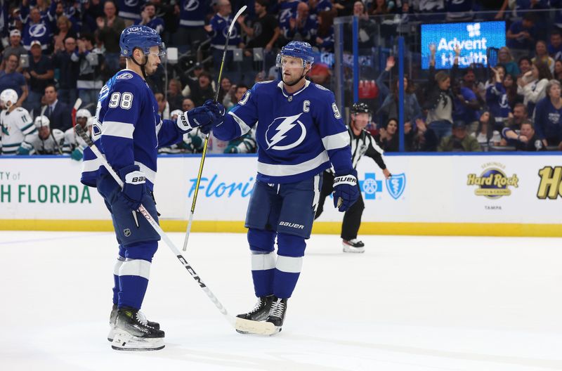 Oct 26, 2023; Tampa, Florida, USA; Tampa Bay Lightning center Steven Stamkos (91) is congratulated by defenseman Mikhail Sergachev (98) after he scored against the San Jose Sharks during the first period at Amalie Arena. Mandatory Credit: Kim Klement Neitzel-USA TODAY Sports