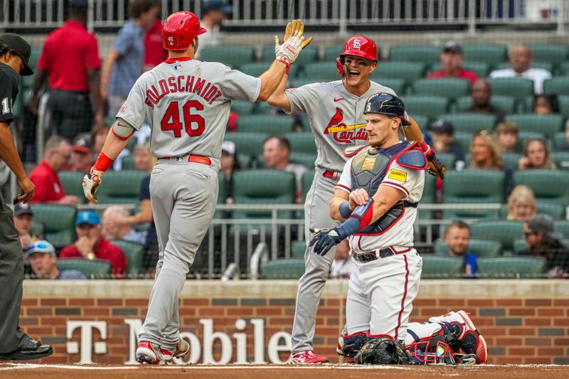 Sep 6, 2023; Cumberland, Georgia, USA; St. Louis Cardinals first baseman Paul Goldschmidt (46) reacts with center fielder Lars Nootbaar (21) after hitting a two run home run against the Atlanta Braves during the first inning at Truist Park. Mandatory Credit: Dale Zanine-USA TODAY Sports