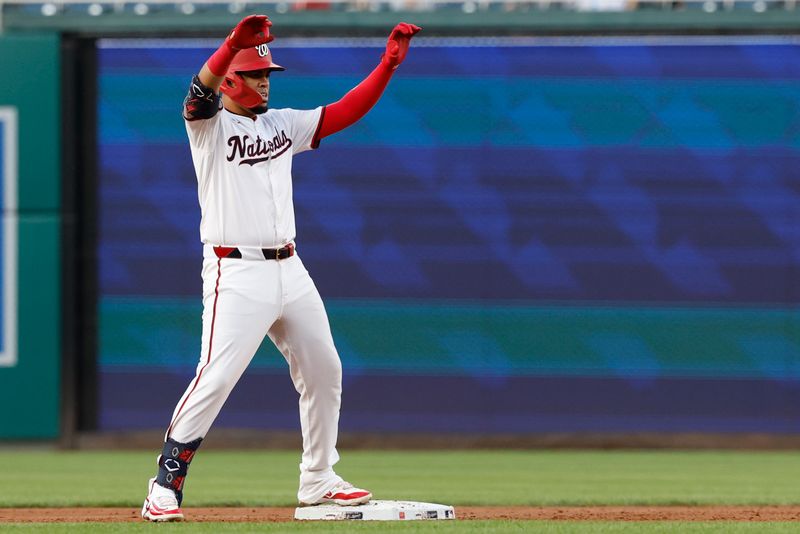 Aug 20, 2024; Washington, District of Columbia, USA; Washington Nationals second baseman Luis García Jr. (2) celebrates towards his dugout after hitting a double against the Colorado Rockies during the second inning at Nationals Park. Mandatory Credit: Geoff Burke-USA TODAY Sports