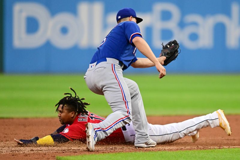 Sep 16, 2023; Cleveland, Ohio, USA; Cleveland Guardians third baseman Jose Ramirez (11) steals second base as Texas Rangers shortstop Corey Seager (5) is late with the tag during the fifth inning at Progressive Field. Mandatory Credit: Ken Blaze-USA TODAY Sports