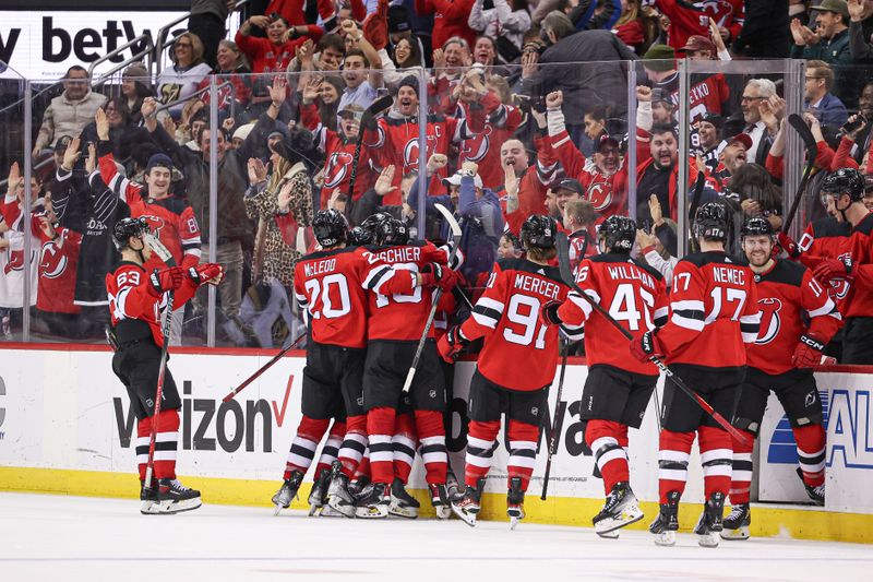 Jan 22, 2024; Newark, New Jersey, USA; New Jersey Devils right wing Tyler Toffoli (73) celebrates his game-winning goal in overtime against the Vegas Golden Knights with teammates at Prudential Center. Mandatory Credit: Vincent Carchietta-USA TODAY Sports