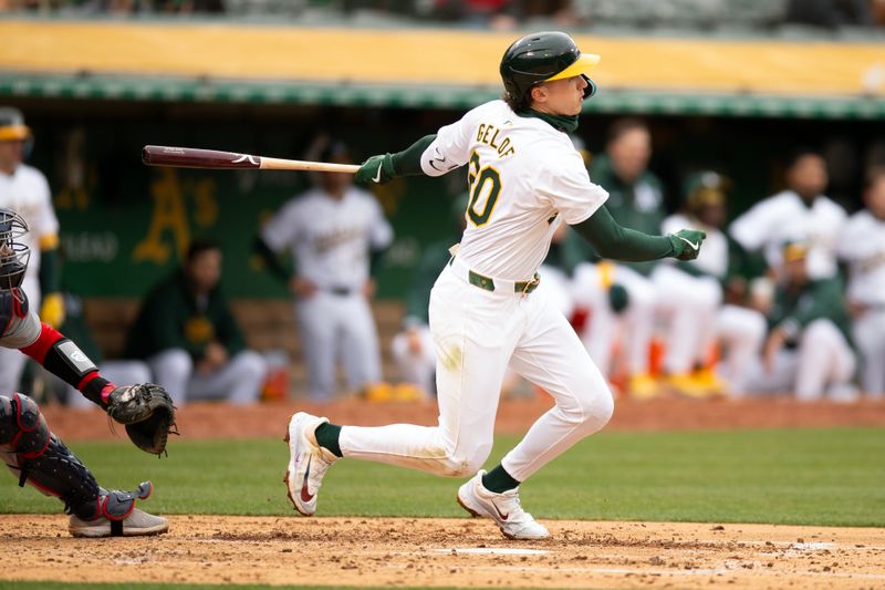 Apr 13, 2024; Oakland, California, USA; Oakland Athletics second baseman Zack Gelof (20) follows through on his single against the Washington Nationals during the third inning at Oakland-Alameda County Coliseum. Mandatory Credit: D. Ross Cameron-USA TODAY Sports
