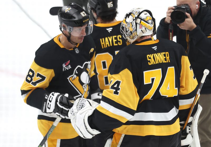 Mar 31, 2026; Pittsburgh, Pennsylvania, USA;  Pittsburgh Penguins center Sidney Crosby (87) and goaltender Stuart Skinner (74) celebrate after defeating the Detroit Red Wings at PPG Paints Arena. Mandatory Credit: Charles LeClaire-Imagn Images