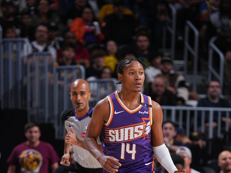 DENVER, CO - OCTOBER 13: TyTy Washington Jr. #14 of the Phoenix Suns dribbles the ball during the game against the Denver Nuggets on October 13, 2024 at Ball Arena in Denver, Colorado. NOTE TO USER: User expressly acknowledges and agrees that, by downloading and/or using this Photograph, user is consenting to the terms and conditions of the Getty Images License Agreement. Mandatory Copyright Notice: Copyright 2024 NBAE (Photo by Garrett Ellwood/NBAE via Getty Images)