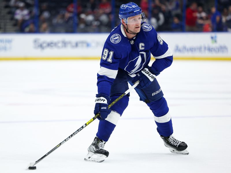 Feb 22, 2024; Tampa, Florida, USA;  Tampa Bay Lightning center Steven Stamkos (91) controls the puck against the Washington Capitals in the third period at Amalie Arena. Mandatory Credit: Nathan Ray Seebeck-USA TODAY Sports