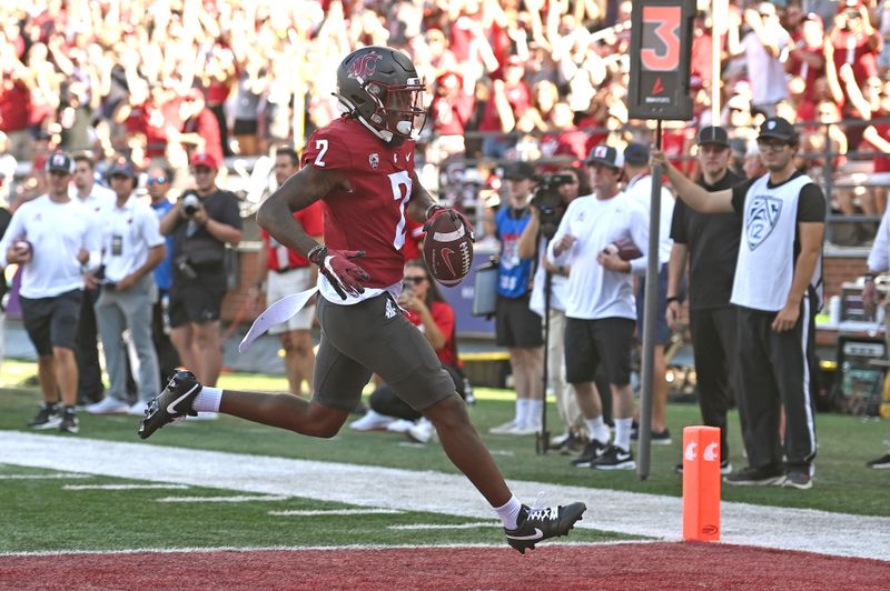 Sep 9, 2023; Pullman, Washington, USA; Washington State Cougars wide receiver Kyle Williams (2) carries the ball in for a score against the Wisconsin Badgers in the first half at Gesa Field at Martin Stadium. Mandatory Credit: James Snook-USA TODAY Sports