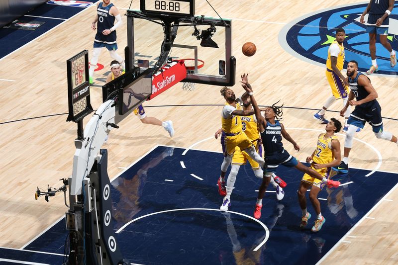 MINNEAPOLIS, MN -  DECEMBER 13:  Rob Dillingham #4 of the Minnesota Timberwolves shoots the ball during the game against the Los Angeles Lakers on December 13, 2024 at Target Center in Minneapolis, Minnesota. NOTE TO USER: User expressly acknowledges and agrees that, by downloading and or using this Photograph, user is consenting to the terms and conditions of the Getty Images License Agreement. Mandatory Copyright Notice: Copyright 2024 NBAE (Photo by David Sherman/NBAE via Getty Images)