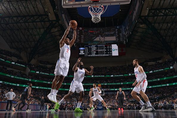 DALLAS, TX - DECEMBER 20: Kawhi Leonard #2 of the LA Clippers grabs the rebound during the game against the Dallas Mavericks on December 20, 2023 at the American Airlines Center in Dallas, Texas. NOTE TO USER: User expressly acknowledges and agrees that, by downloading and or using this photograph, User is consenting to the terms and conditions of the Getty Images License Agreement. Mandatory Copyright Notice: Copyright 2023 NBAE (Photo by Glenn James/NBAE via Getty Images)