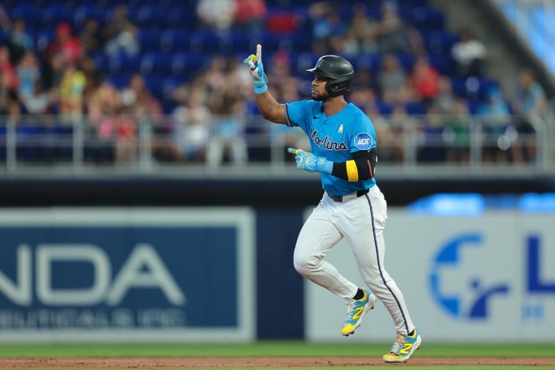 Sep 7, 2025; Miami, Florida, USA; Miami Marlins shortstop Otto Lopez (6) circles the bases after hitting a three-run home run against the Philadelphia Phillies during the first inning at loanDepot Park. Mandatory Credit: Sam Navarro-Imagn Images