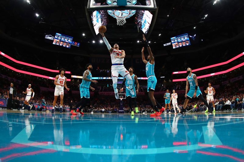 CHARLOTTE, NORTH CAROLINA - JANUARY 29: Josh Hart #3 of the New York Knicks attempts a lay up during the second half of the game against the Charlotte Hornets at Spectrum Center on January 29, 2024 in Charlotte, North Carolina. NOTE TO USER: User expressly acknowledges and agrees that, by downloading and or using this photograph, User is consenting to the terms and conditions of the Getty Images License Agreement. (Photo by Jared C. Tilton/Getty Images)