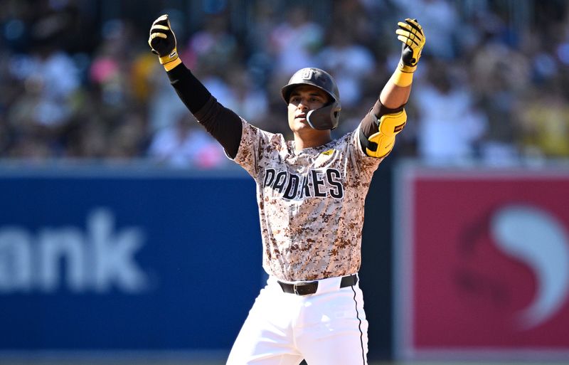 Sep 22, 2024; San Diego, California, USA; San Diego Padres first baseman Donovan Solano (39) celebrates after hitting a double against the Chicago White Sox during the eighth inning at Petco Park. Mandatory Credit: Orlando Ramirez-Imagn Images