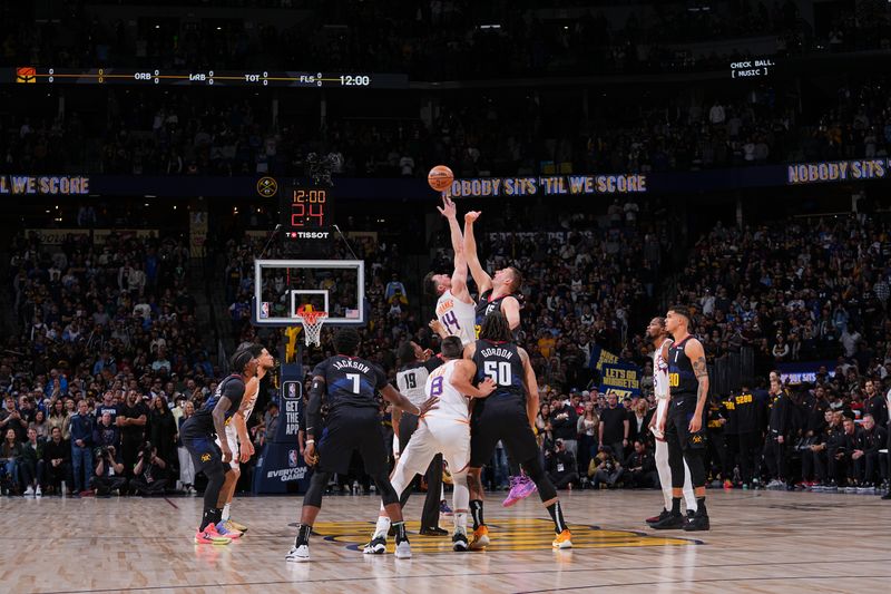 DENVER, CO - MARCH 27: Opening tip-off between Drew Eubanks #14 of the Phoenix Suns & Nikola Jokic #15 of the Denver Nuggets on March 27, 2024 at the Ball Arena in Denver, Colorado. NOTE TO USER: User expressly acknowledges and agrees that, by downloading and/or using this Photograph, user is consenting to the terms and conditions of the Getty Images License Agreement. Mandatory Copyright Notice: Copyright 2024 NBAE (Photo by Bart Young/NBAE via Getty Images)