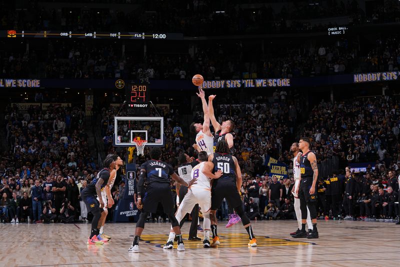 DENVER, CO - MARCH 27: Opening tip-off between Drew Eubanks #14 of the Phoenix Suns & Nikola Jokic #15 of the Denver Nuggets on March 27, 2024 at the Ball Arena in Denver, Colorado. NOTE TO USER: User expressly acknowledges and agrees that, by downloading and/or using this Photograph, user is consenting to the terms and conditions of the Getty Images License Agreement. Mandatory Copyright Notice: Copyright 2024 NBAE (Photo by Bart Young/NBAE via Getty Images)