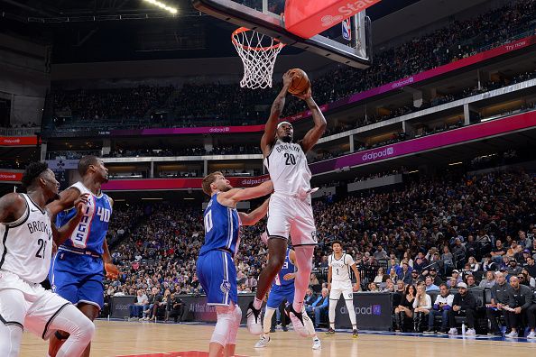 SACRAMENTO, CA - DECEMBER 11: Day'Ron Sharpe #20 of the Brooklyn Nets drives to the basket during the game against the Sacramento Kings on December 11, 2023 at Golden 1 Center in Sacramento, California. NOTE TO USER: User expressly acknowledges and agrees that, by downloading and or using this Photograph, user is consenting to the terms and conditions of the Getty Images License Agreement. Mandatory Copyright Notice: Copyright 2023 NBAE (Photo by Rocky Widner/NBAE via Getty Images)