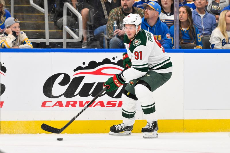 Oct 9, 2025; St. Louis, Missouri, USA; Minnesota Wild right wing Vladimir Tarasenko (91) controls the puck against the St. Louis Blues during the first period at Enterprise Center. Mandatory Credit: Jeff Curry-Imagn Images