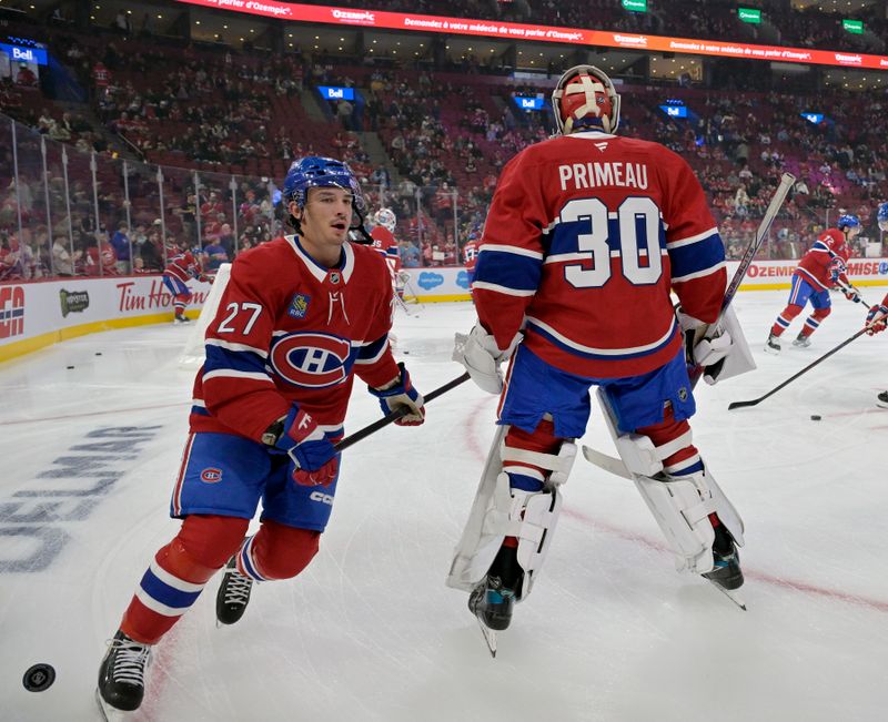 Oct 9, 2024; Montreal, Quebec, CAN; Montreal Canadiens forward Alex Barre-Boulet (27) and teammate goalie Cayden Primeau (30) skate during the warmup period before the game against the Toronto Maple Leafs at the Bell Centre. Mandatory Credit: Eric Bolte-Imagn Images