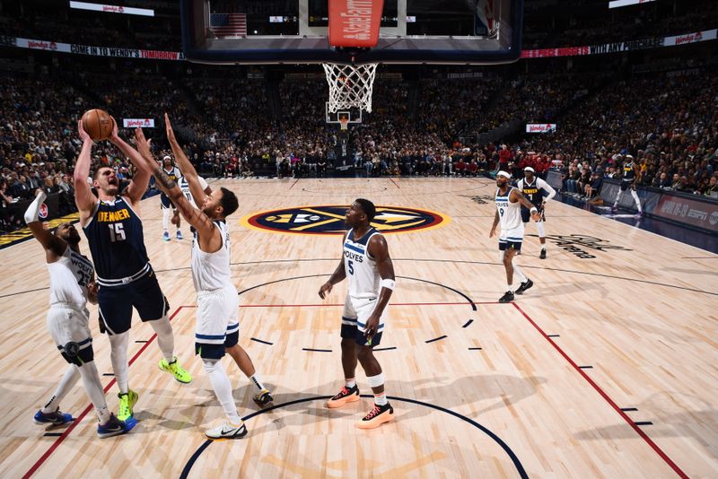 DENVER, CO - APRIL 10: Nikola Jokic #15 of the Denver Nuggets drives to the basket during the game against the Minnesota Timberwolves on April 10, 2024 at the Ball Arena in Denver, Colorado. NOTE TO USER: User expressly acknowledges and agrees that, by downloading and/or using this Photograph, user is consenting to the terms and conditions of the Getty Images License Agreement. Mandatory Copyright Notice: Copyright 2024 NBAE (Photo by Garrett Ellwood/NBAE via Getty Images)