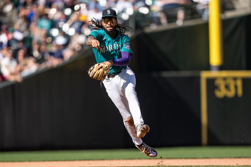 Sep 13, 2023; Seattle, Washington, USA; Seattle Mariners shortstop J.P. Crawford (3) throws to first base for an out after fielding a ground ball during the seventh inning against the Los Angeles Angels at T-Mobile Park. Mandatory Credit: Stephen Brashear-USA TODAY Sports