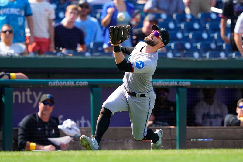 Sep 3, 2023; Washington, District of Columbia, USA; Miami Marlins third baseman Jon Berti (5) catches a foul ball hit by Washington Nationals shortstop CJ Abrams (not pictured) during the fifth inning at Nationals Park. Mandatory Credit: Gregory Fisher-USA TODAY Sports