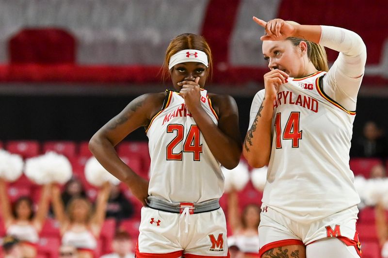 Feb 29, 2024; College Park, Maryland, USA;  Maryland Terrapins guard Bri McDaniel (24) and forward Allie Kubek (14) speak during the second half against the Wisconsin Badgers at Xfinity Center. Mandatory Credit: Tommy Gilligan-USA TODAY Sports