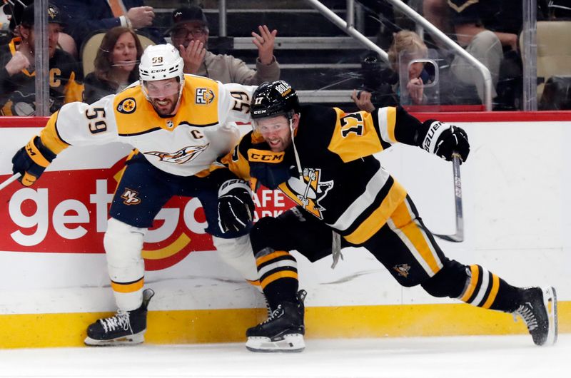 Apr 15, 2024; Pittsburgh, Pennsylvania, USA;  Nashville Predators defenseman Roman Josi (59) defends Pittsburgh Penguins right wing Bryan Rust (17) during the third period at PPG Paints Arena. The Penguins won 4-2. Mandatory Credit: Charles LeClaire-USA TODAY Sports