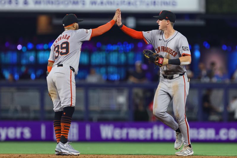 Apr 17, 2024; Miami, Florida, USA; San Francisco Giants left fielder Tyler Fitzgerald (49) celebrates with second baseman Thairo Estrada (39) after the game against the Miami Marlins at loanDepot Park. Mandatory Credit: Sam Navarro-USA TODAY Sports