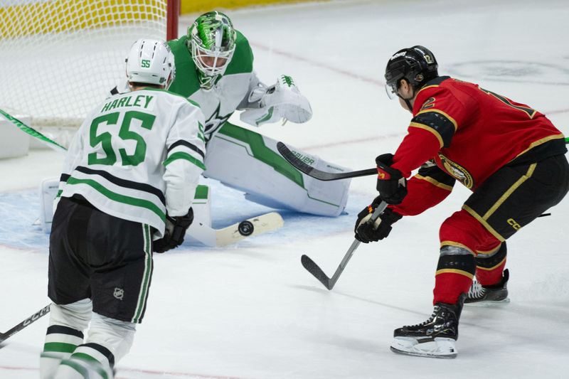 Nov 11, 2025; Ottawa, Ontario, CAN; Dallas Starsc goalie Jake Oettinger (29) makes a save on a shot from  Ottawa Senators center Shane Pinto (12) in overtime at the Canadian Tire Centre. Mandatory Credit: Marc DesRosiers-IMAGN Images