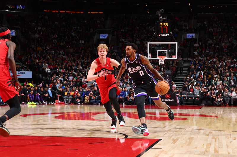 TORONTO, CANADA - MARCH 20: Malik Monk #0 of the Sacramento Kings dribbles the ball during the game against the Toronto Raptors on March 20, 2024 at the Scotiabank Arena in Toronto, Ontario, Canada.  NOTE TO USER: User expressly acknowledges and agrees that, by downloading and or using this Photograph, user is consenting to the terms and conditions of the Getty Images License Agreement.  Mandatory Copyright Notice: Copyright 2024 NBAE (Photo by Vaughn Ridley/NBAE via Getty Images)