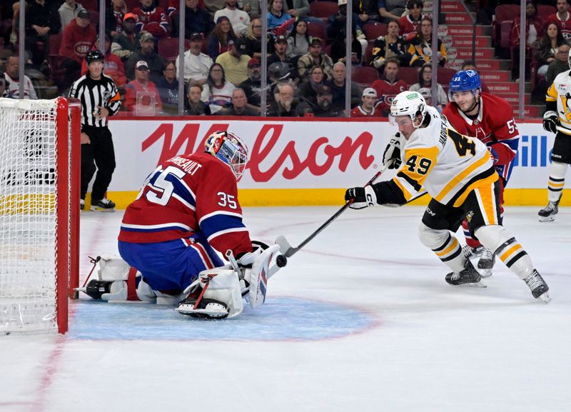 Sep 22, 2025; Montreal, Quebec, CAN; Montreal Canadiens goalie Sam Montembeault (35) stops Pittsburgh Penguins forward Rafael Harvey-Pinard (49) during the first period at the Bell Centre. Mandatory Credit: Eric Bolte-Imagn Images