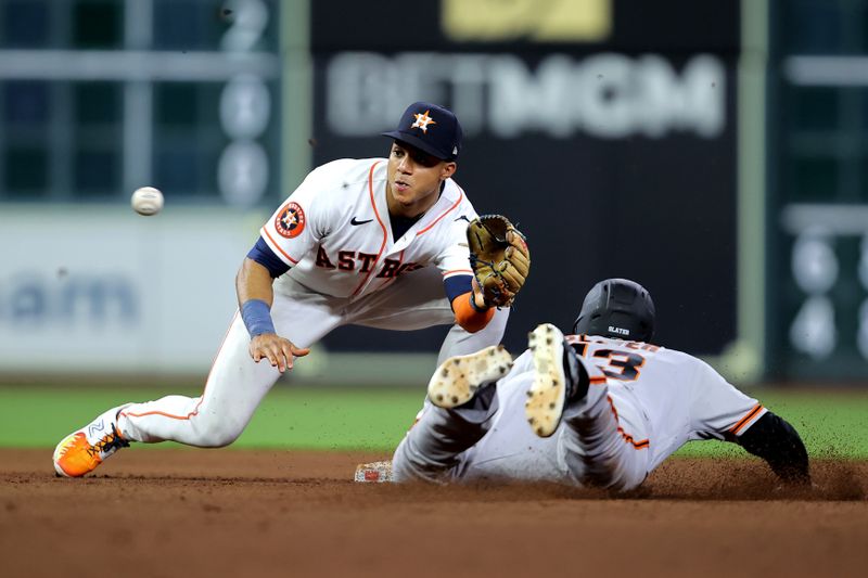 May 2, 2023; Houston, Texas, USA; Houston Astros shortstop Jeremy Pena (3) tags out San Francisco Giants pinch runner Austin Slater (13) on a stolen base attempt during the eighth inning at Minute Maid Park. Mandatory Credit: Erik Williams-USA TODAY Sports