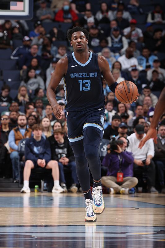 MEMPHIS, TN - JANUARY 29:  Jaren Jackson Jr. #13 of the Memphis Grizzlies handles the ball during the game against the Sacramento Kings on January 29, 2024 at FedExForum in Memphis, Tennessee. NOTE TO USER: User expressly acknowledges and agrees that, by downloading and or using this photograph, User is consenting to the terms and conditions of the Getty Images License Agreement. Mandatory Copyright Notice: Copyright 2024 NBAE (Photo by Joe Murphy/NBAE via Getty Images)