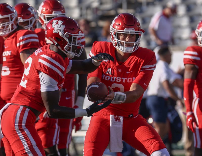 Sep 25, 2021; Houston, Texas, USA; Houston Cougars quarterback Clayton Tune (3) warms up before the game against the Navy Midshipmen at TDECU Stadium. Mandatory Credit: Troy Taormina-USA TODAY Sports