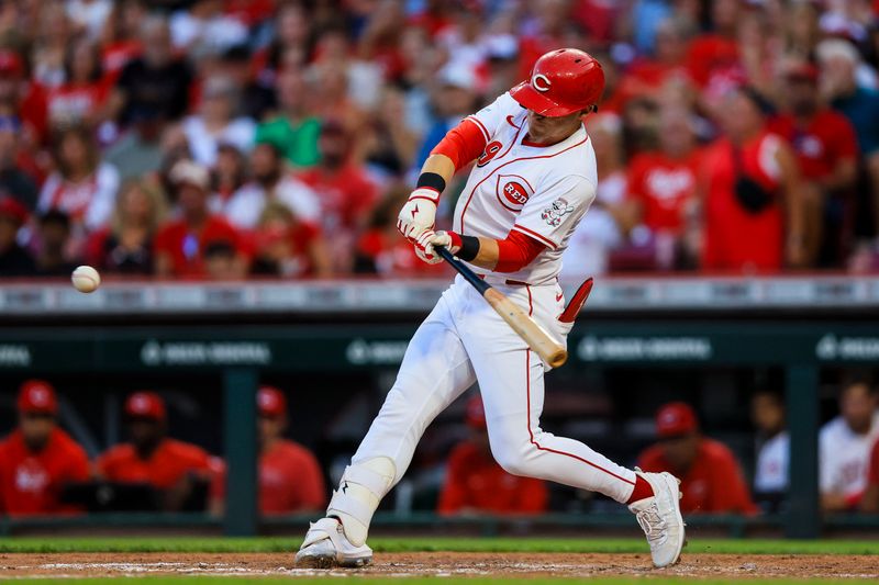 Aug 14, 2024; Cincinnati, Ohio, USA; Cincinnati Reds outfielder TJ Friedl (29) hits a solo home run in the fifth inning against the St. Louis Cardinals at Great American Ball Park. Mandatory Credit: Katie Stratman-USA TODAY Sports