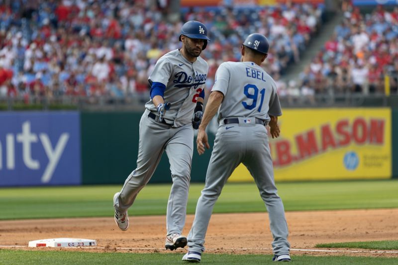 Jun 10, 2023; Philadelphia, Pennsylvania, USA; Los Angeles Dodgers designated hitter J.D. Martinez (28) is congratulated by third base coach Dino Ebel (91) after hitting a three RBI home run during the seventh inning against the Philadelphia Phillies at Citizens Bank Park. Mandatory Credit: Bill Streicher-USA TODAY Sports