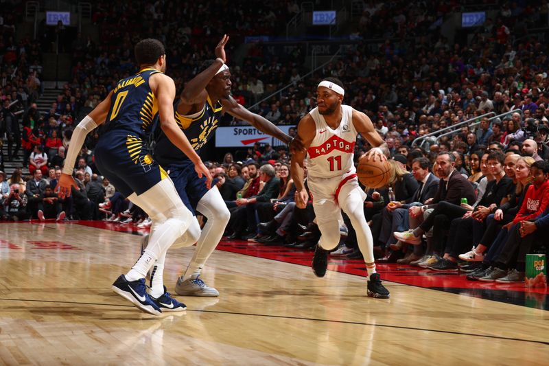 TORONTO, CANADA - APRIL 9: Pascal Siakam #43 of the Indiana Pacers plays defense during the game  against Bruce Brown #11 of the Toronto Raptors  on April 9, 2024 at the Scotiabank Arena in Toronto, Ontario, Canada.  NOTE TO USER: User expressly acknowledges and agrees that, by downloading and or using this Photograph, user is consenting to the terms and conditions of the Getty Images License Agreement.  Mandatory Copyright Notice: Copyright 2024 NBAE (Photo by Vaughn Ridley/NBAE via Getty Images)