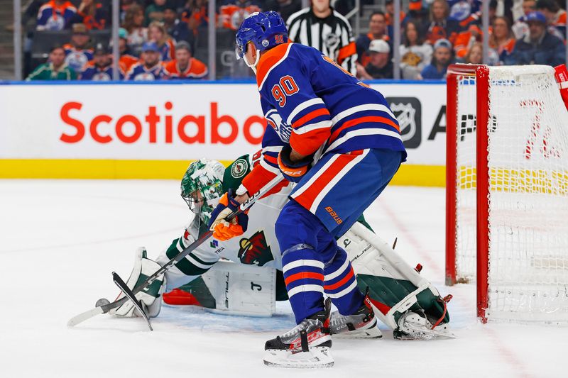 Nov 21, 2024; Edmonton, Alberta, CAN; Minnesota Wild goaltender Marc-Andre Fleury (29) makes a save on  on a deflection by Edmonton Oilers forward Corey Perry (90) during the third period at Rogers Place. Mandatory Credit: Perry Nelson-Imagn Images