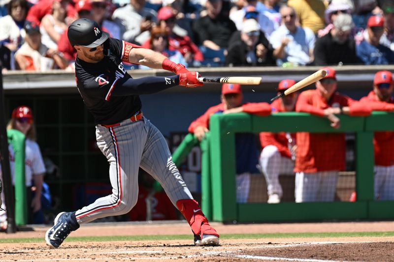 Mar 21, 2025; Clearwater, Florida, USA; Minnesota Twins catcher Ryan Jeffers (27) hits a infield single to drive in a run  in the third inning against the Philadelphia Phillies during spring training  at BayCare Ballpark. Mandatory Credit: Jonathan Dyer-Imagn Images