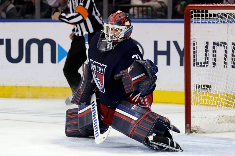 Dec 6, 2024; New York, New York, USA; New York Rangers goaltender Igor Shesterkin (31) makes a save against the Pittsburgh Penguins during the second period at Madison Square Garden. Mandatory Credit: Brad Penner-Imagn Images