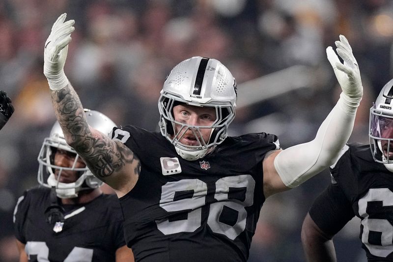 Las Vegas Raiders defensive end Maxx Crosby fires up the crowd during an NFL football game against the Pittsburgh Steelers Sunday, Sept. 24, 2023, in Las Vegas. (AP Photo/Mark J. Terrill)